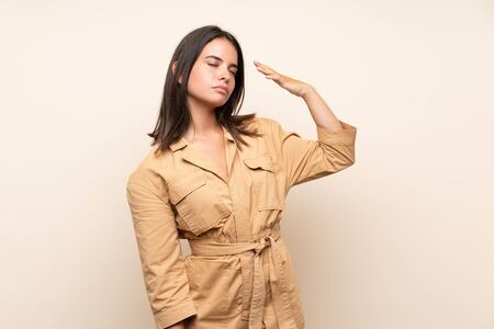Young girl over isolated background with tired and sick expressionの写真素材