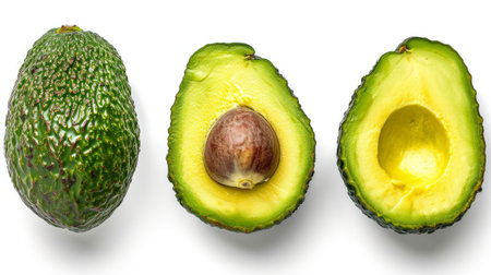An avocado cut in half with a whole avocado next to itの素材