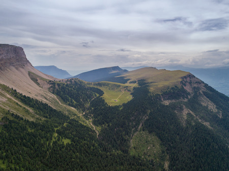 Aerial Drone photo of Santa Magdalena St Maddalena Val di Funes in Dolomites Italian Alps with Furchetta mountain peak on the backgroundの写真素材