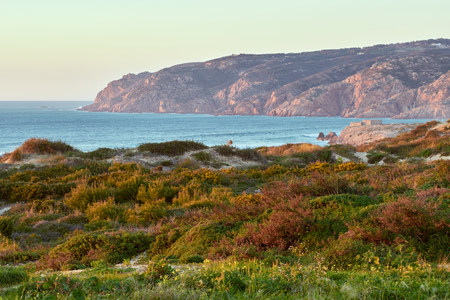 Praia do Guincho beach sand dunes and the coastline at sunsetの写真素材