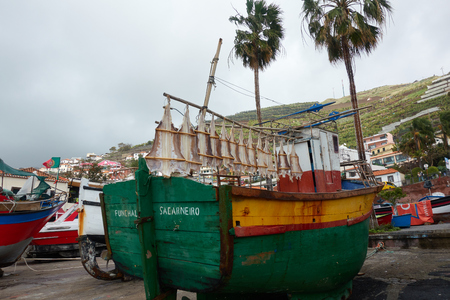 Fishing boat Sa Carneiro with codfish dryingの写真素材