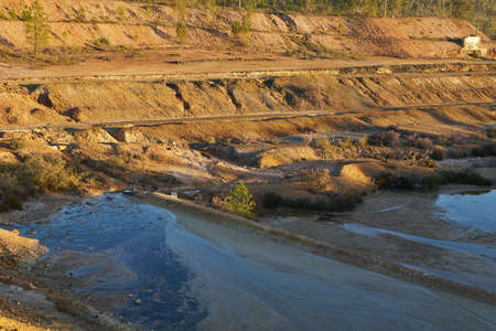 Contaminated pond lake of an old abandoned mine red landscape in Mina de Sao Domingos, Portugalの写真素材