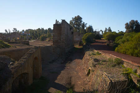 Abandoned ruin mine buildings red landscape in Mina de Sao Domingos, Portugalの写真素材