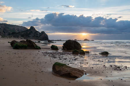 Praia do amado beach at sunset in Costa Vicentina, Portugalの写真素材
