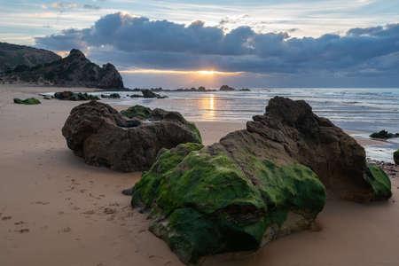 Praia do amado beach at sunset in Costa Vicentina, Portugalの写真素材