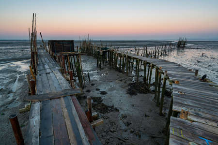 Carrasqueira Palafitic Pier in Comporta, Portugal at sunsetの写真素材