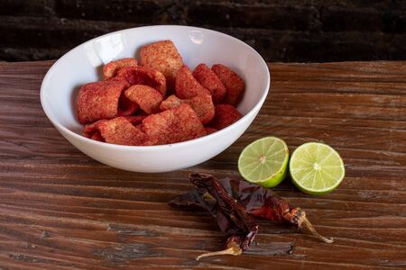 Snacks from mexico in a bowl with chilli and limeの写真素材