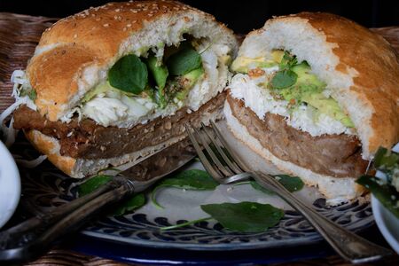 Cemita poblana sliced in half and served in a talavera plateの写真素材