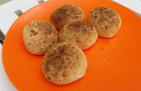 Roast cheese breads on the orange plastic dishの写真素材