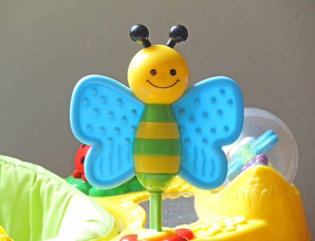 Detail of a colorful plastic toy butterflyの写真素材