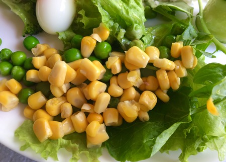 Corn salad with peas and green leavesの写真素材