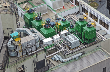 Complex air conditioning system installed on top of a buildingの写真素材