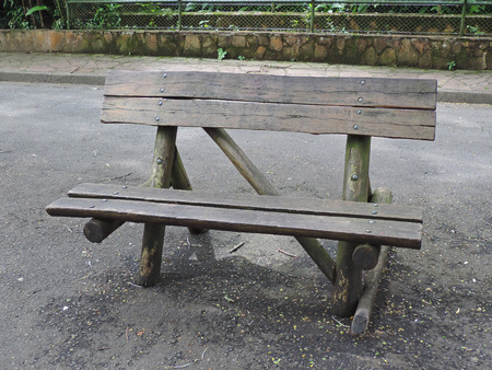 Old rustic wooden bench in a park