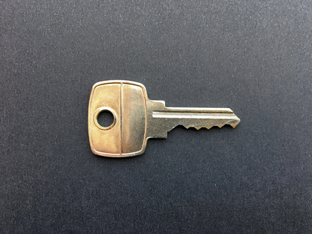 A silver key on a dark backgroundの写真素材