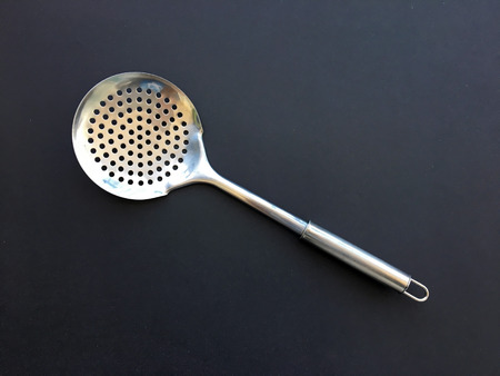 A silver skimmer on the dark backgroundの写真素材