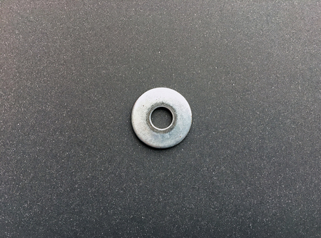A metal washer on the dark backgroundの写真素材