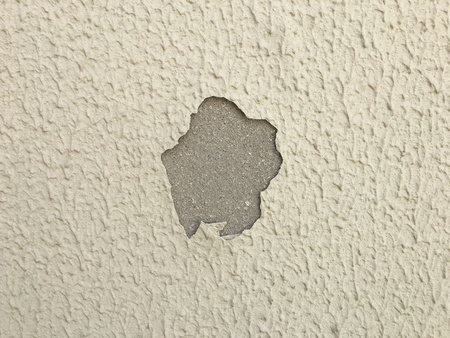 Detail of a textured wall with peeled paintの写真素材