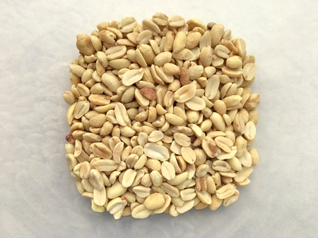 A portion of peeled and roasted peanuts