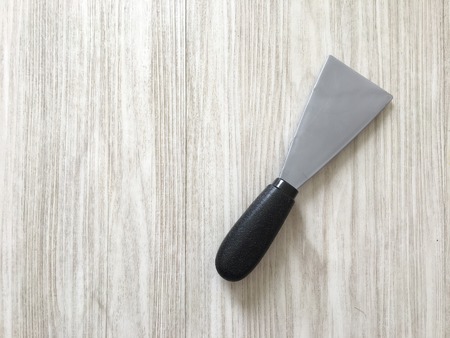 A plastic spatula on the wooden backgroundの写真素材