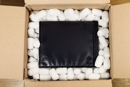 shipping box with black dvd boxの写真素材
