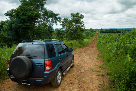 Car on a dirt road in the Misiones province of Argentinaのeditorial素材