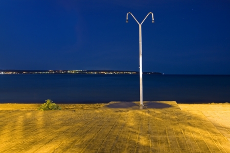 Night view of a lonely shower in a beachの写真素材