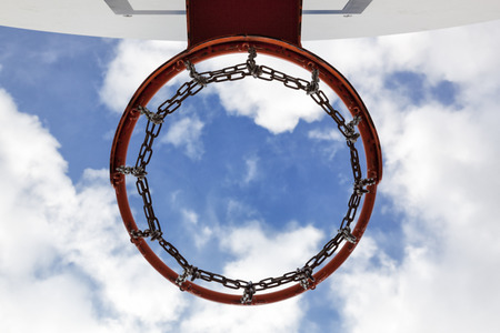 Hoop seen from below with a cloudy blue sky as backgroundの写真素材