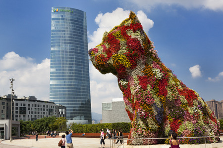 Tourists photographing the big floral dog のeditorial素材