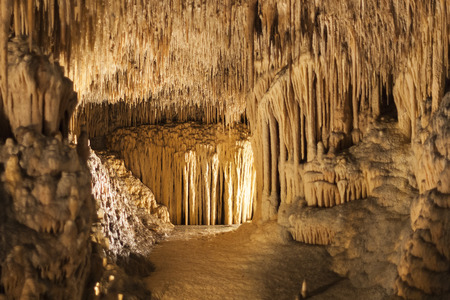 Stalactites and stalagmites in coves del Drach in Majorca, with one of the largest subterranean salty lakes in the worldの写真素材