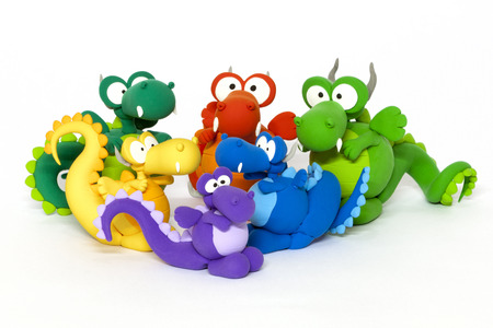 Multicolored handmade modelling clay dragons on whiteの写真素材