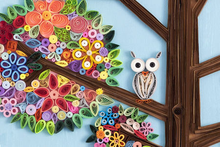 Owl on a branch of a quilling art treeの写真素材