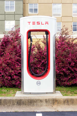 Tesla supercharger station in a parking area.のeditorial素材