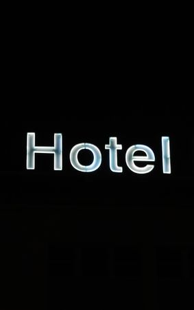 photo of a Hotel sign on black backgroundの写真素材
