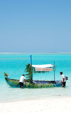beautiful scenic with typical boat ready for just married couple in Maldivesの写真素材