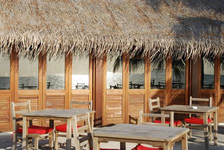 beautiful photo of a typical restaurant setting in a maldivian island (ocean reflection)の写真素材