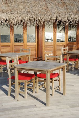 beautiful photo of a typical restaurant setting in a maldivian island (ocean reflection)の写真素材