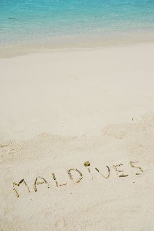 Maldives note written on a white sandy beachの写真素材