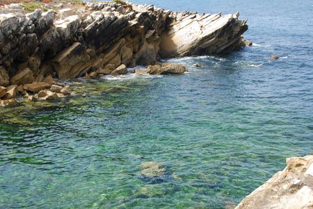 beautiful green seascape between huge rocksの写真素材