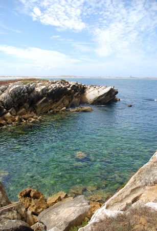beautiful green seascape between huge rocksの写真素材