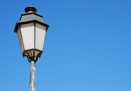 vintage lamp post against blue sky backgroundの写真素材