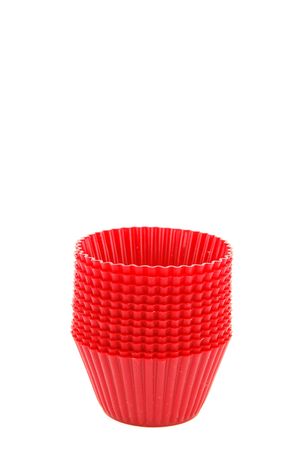 pile of red plastic cups isolated on white backgroundの写真素材