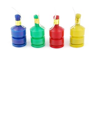 colorful party poppers isolated on white backgroundの写真素材