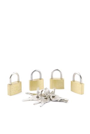 golden closed padlocks with keys isolated on white backgroundの写真素材