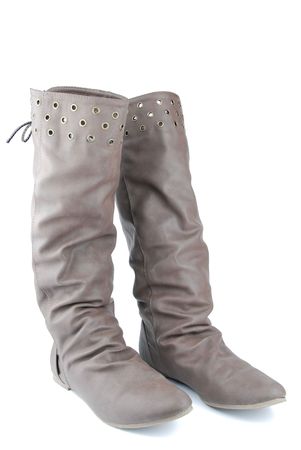 women brown leather boots isolated on white backgroundの写真素材