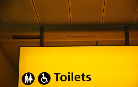 yellow public toilets WC sign (men, women and wheelchair)の写真素材