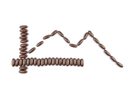 business graph concept for world crisis with chocolate candies (isolated on white background)の写真素材
