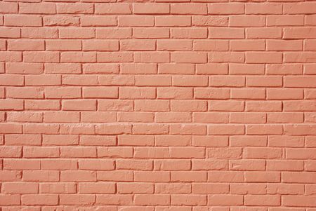 background or texture of a salmon/pink brick wallの写真素材