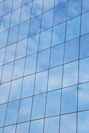 modern office building facade with glass patternの写真素材