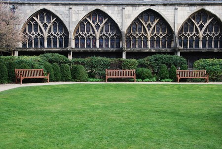 exterior garden with benchs inside the famous Gloucester Cathedral, England (United Kingdom)のeditorial素材