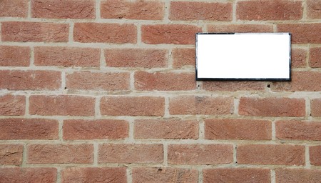 empty billboard on a beautiful brick wall buildingの写真素材